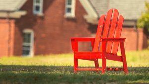 Empty red chair on a summer day