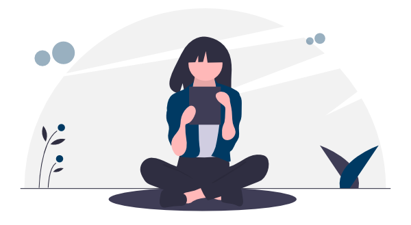 Person sitting on the ground looking at a tablet.